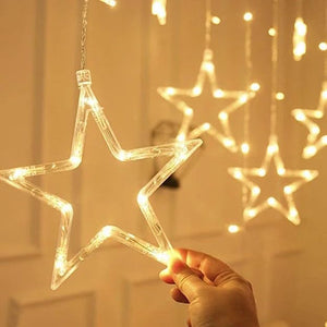 Star-shaped curtain light with 5 small stars and 5 big stars illuminated, showcasing its warm white light for festive decoration.