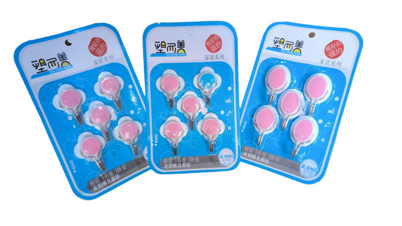 Self-adhesive sticky hooks, cute character design, pack of three. Easy peel and stick wall hooks for home and kitchen organization. No drill mounting plastic hooks for hanging keys, lightweight items. Colorful and practical storage solution.