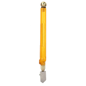 A glass cutter with a transparent amber plastic handle, metal cutting wheel, and brass tapping ball.glass cutter, amber handle, cutting tool, hand tool.