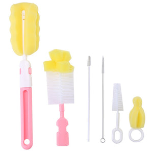 A six-piece baby bottle cleaning kit with various brushes and a sponge. bottle brush, baby, cleaning kit, nursery.