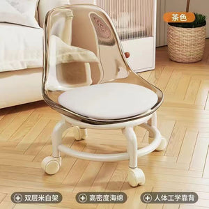 Acrylic swivel chairs in Golden cushions and bases are on a patterned rug.Swivel chair, modern chair, office chair.