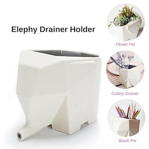 The Elephy Drainer Holder, an elephant-shaped container in crisp white, offers versatility with three uses. Perfect as a cutlery holder, flower pot, or brush pot, its trunk cleverly acts as a spout for drainage. Ideal for kitchen utensil storage and more.