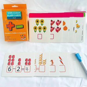 A set of wipe-clean flashcards for counting, addition, and subtraction is displayed with its orange packaging and a blue marker. The cards feature colorful illustrations of objects like sunflowers, cakes, oranges, ducks, strawberries, and bananas, along with simple math problems and blank squares for answers. Math flashcards, wipe-clean cards, early math, counting, addition, subtraction, educational toys.