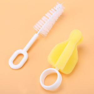 Two small brushes for cleaning baby bottle nipples: one bristle, one sponge.nipple brush, baby, cleaning, nursery.