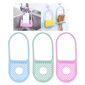 Three foldable silicone sink caddies in light blue, light green, and light pink are arranged vertically against a white background. In background there is showing that its functionality