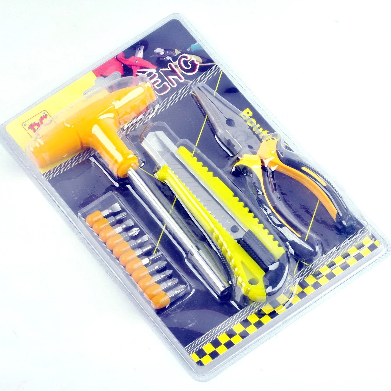A blister pack contains a small yellow T-handle wrench, screwdriver bits, utility knife, and pliers.Tool kit, mini tools, hand tools, repair kit.