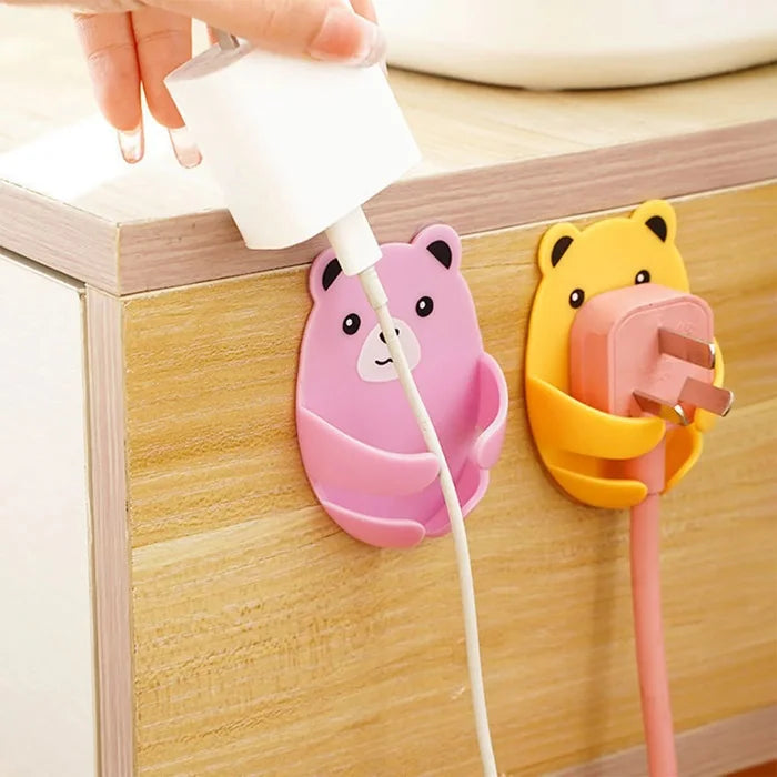 4 Pcs Bear Shaped Plug Holder – Cute Wall Socket Protector & Organizer (Random colors)