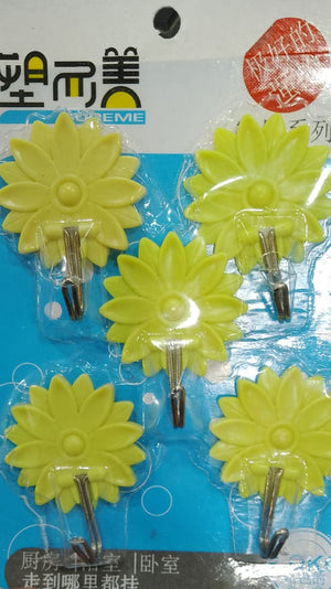 packs of DESiY, yellow self-adhesive hooks. Each pack contains five plastic hooks designed for easy, no-drill wall mounting. The packaging suggests they are "strong" and suitable for organizing lightweight items in homes.emoji hooks, sticky hooks, cute hooks, wall organization, self-adhesive.