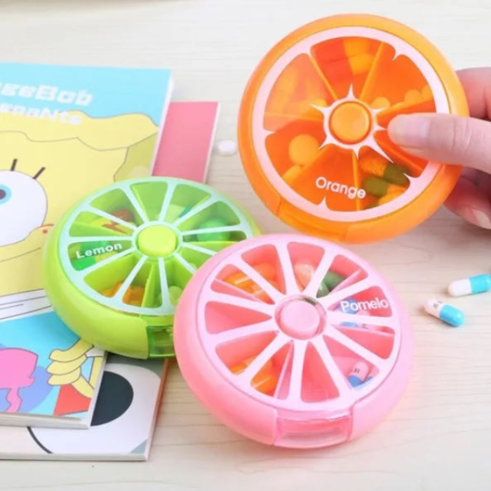 7 Compartment Weekly Pill Box – Rotating Round Storage Box for Medicines (Random color- Pack of 1)