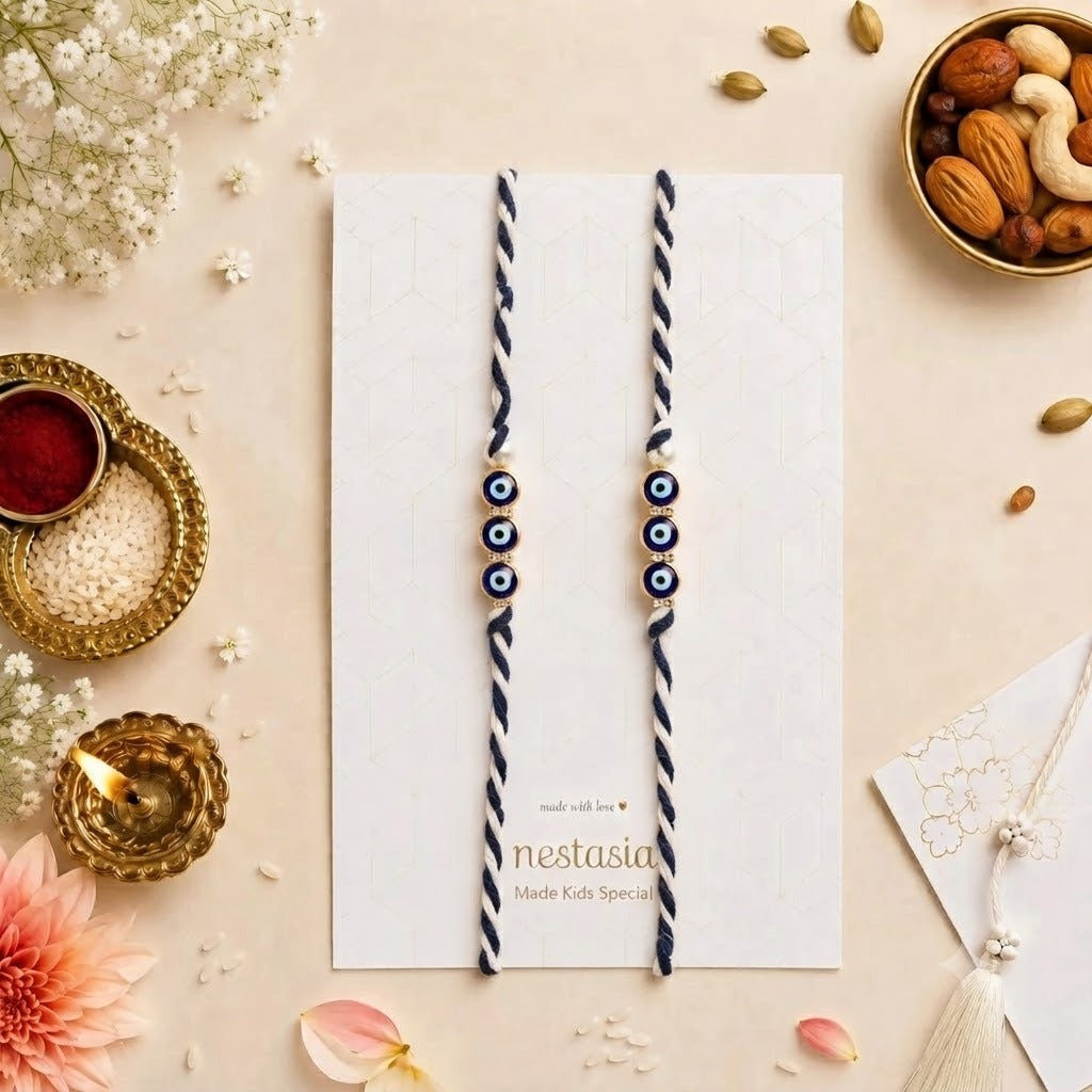 Handmade Evil Eye Nazar Rakhi for Brother | Adjustable Blue Thread Rakhi with Pearl & Gold Charm | Premium Designer Raksha Bandhan Rakhi (Pack of 1)