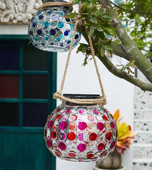 Decorative hanging solar lamp with a textured crystal ball design, suspended outdoors to highlight ambient lighting potential - Home Decor Items, Home Accessories