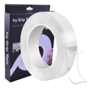 Clear, thick, double-sided nano adhesive tape unrolled slightly to show its transparency and adhesive properties.