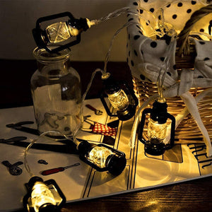 Mini kerosene lantern-style string lights creating festive ambience for holidays and events