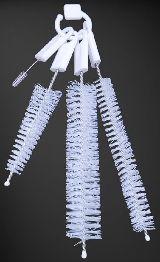 Four white cleaning brushes of varying sizes hang from a white ring against a dark background.bottle brush, cleaning brush, kitchen brush, set.