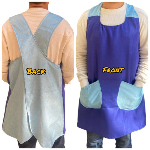 A man wearing a Blue and Navy blue pinafore apron with two front pockets over a Tshirt and Jeans patterned.