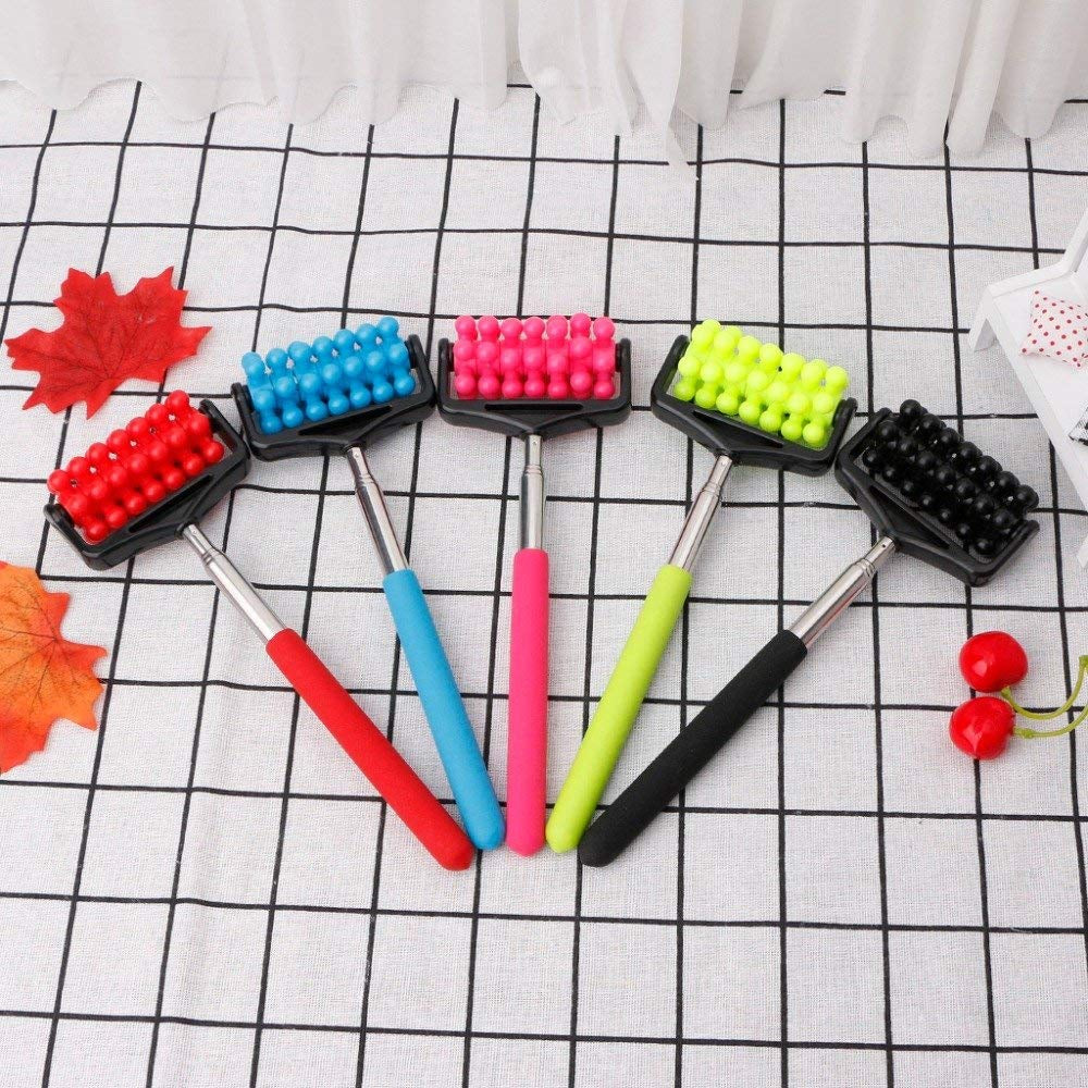 Five telescopic back rollers with red, blue, pink, green, and black rollers on a checkered cloth.back roller, massager, colorful, telescopic.