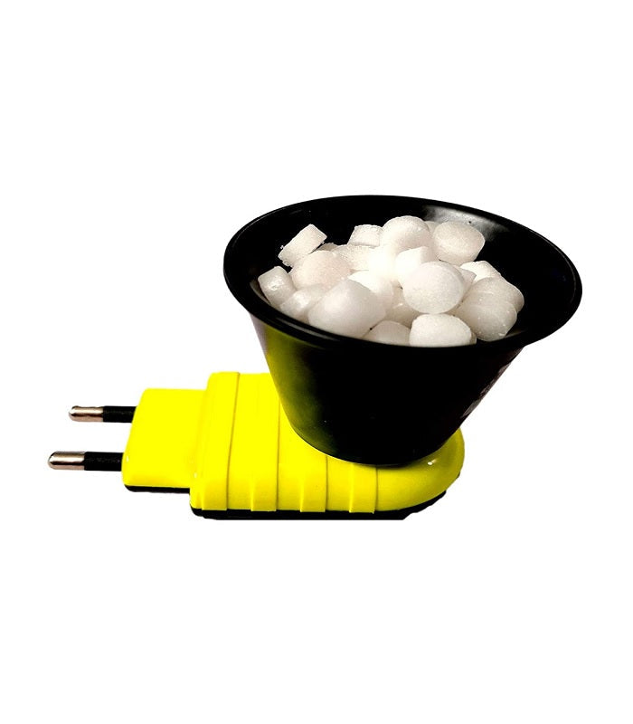 A yellow electric Kapoor Dani (camphor burner) is plugged in, with a black bowl on top filled with white camphor tablets. The device is isolated against a white background. Electric Kapoor Dani, camphor burner, incense burner, puja item, religious product.