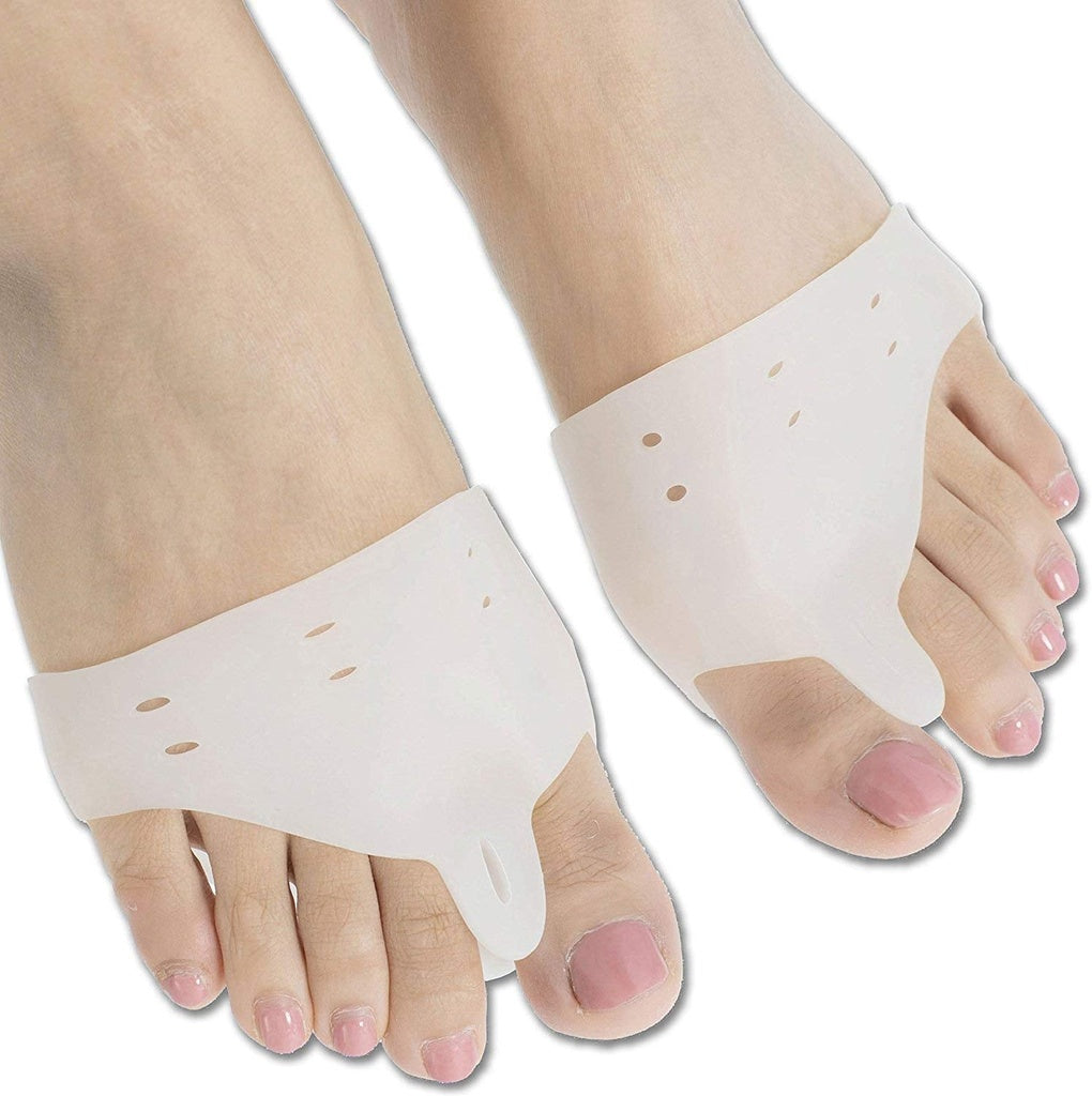 A close-up shows two bare feet, each wearing a white silicone gel toe separator that fits between the big toe and the second toe. toe separators, toe spacer, bunion corrector, hallux valgus, foot care, orthopedic, health and personal care, silicone gel.