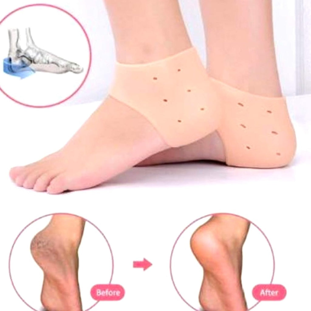 A close-up shows two bare feet, each wearing a beige silicone heel protector that covers the heel and has small ventilation holes.silicone heel protector, heel sleeve, heel cushion, foot protection, plantar fasciitis, heel pain, foot care, health and personal care.