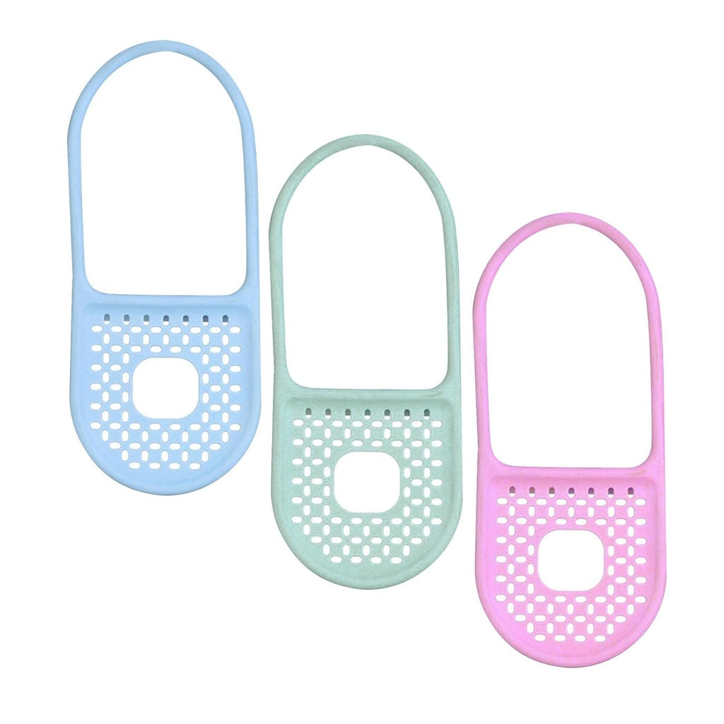  Three foldable silicone sink caddies in light blue, light green, and light pink are arranged Randomly against a white background.kitchen accessories, household items, kitchen items, bathroom storage.