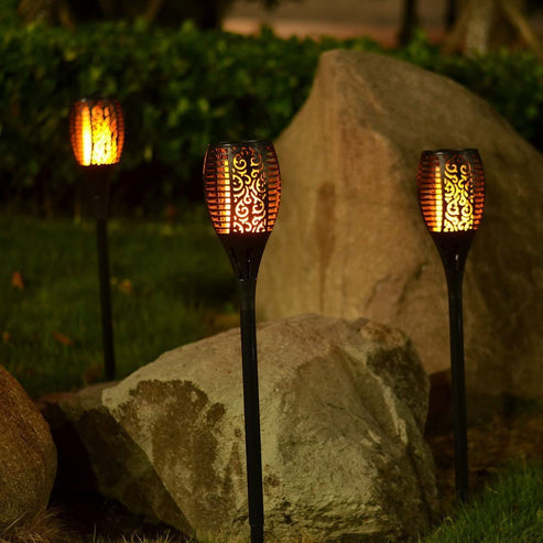 Flickering flame effect solar torch light in warm yellow for patio decor