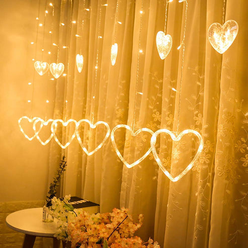 Heart-shaped curtain light with 6 big hearts and 6 small hearts for decoration hanging on a wall