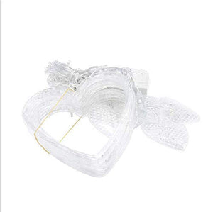 Heart-shaped curtain light with 6 big hearts and 6 small hearts for decoration hanging on a window