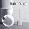 Silicone flex toilet brush with holder placed besides a toilet seat in the bathroom.
