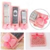 Pink color remote cover set is showcased. The remote cover set is used in 3 different sizes of remote in the picture.