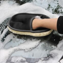 Women is cleaning car with car wash mitt glove which is bear paw shaped reusable cleaning gloves.