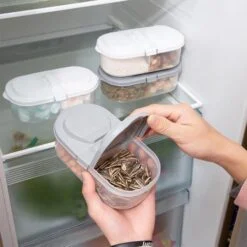 A home maker is using 2 way container for food storage. Also a few 2 way containers are kept in fridge for food storage.