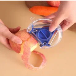 Lady is using 3 in 1 peeler to peel off apple. The 3 in 1 peeler used in the image is of blue color.