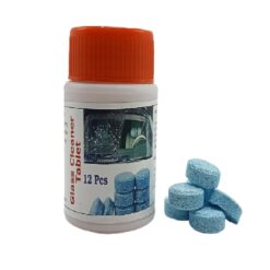 Bottle of Glass cleaning tablet is placed along with few glass cleaning tablet lying beside the bottle.