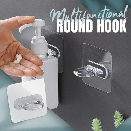 2 sticky hanging hooks are mounted on a wall. A liquid dispenser is inserted in one of the sticky hanging hooks.