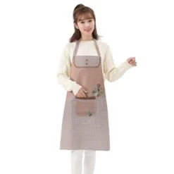 A girl is wearing kitchen cooking apron.