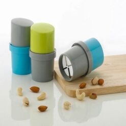 Easy dry fruit slicer along with almonds and cashew nuts and a chopping board.