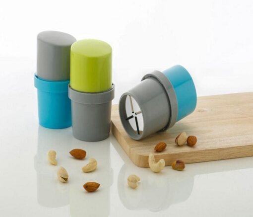 Easy dry fruit slicer along with almonds and cashew nuts and a chopping board.
