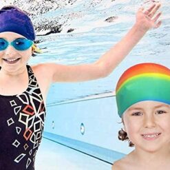 One girl is wearing navy blue color silicone swimcap while another one is wearing multicolor silicone swimcap.