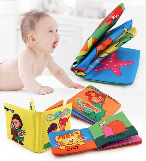 A baby is surrounded by several fabric activity book.