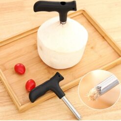 Stainless steel coconut opener is placed on a wooden tray.