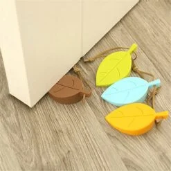 Door stopper leaf is presented in multiple colors like brown, lemon yellow, mustard yellow, and blue.