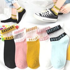Different color letter printed socks are shown. A girl wearing black color letter printed socks.