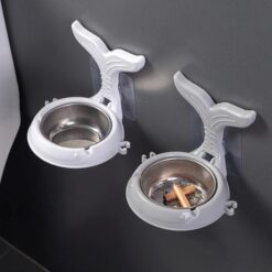 Fish shape wall mounted ash tray is presented in two different colors - white and grey. Both of them are mounted on a wall.