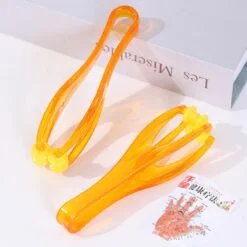 Rotating finger massager pair of yellow color is placed