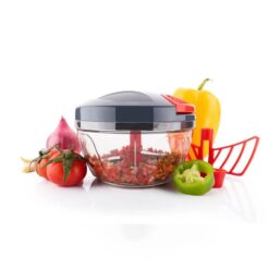 Grey color 2 in 1 vegetable chopper is placed along with tomatoes, onion, capsicum, and bell pepper.
