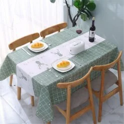 PVC dining table cover is placed on a dining table.