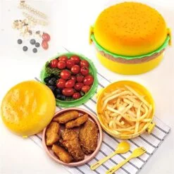 Burger shape tiffin box is mentioned along with few eatables and meals.