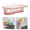 Pink color bathroom shelf with towel bar is being used to keep shower utilities and napkins.