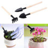 3 Mini garden tools. Two of them are being used in plants.