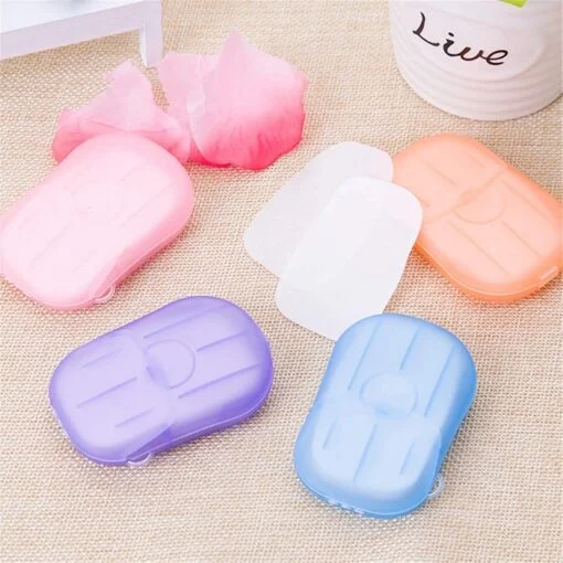 Portable hand soap sheets with different color cases are kept on a table.